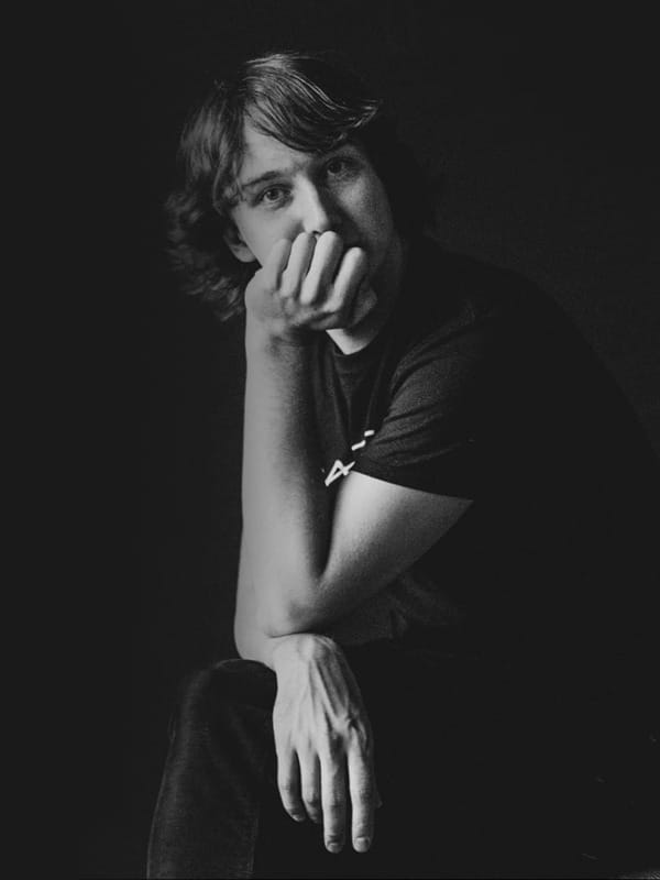 Conductor Maxim Emelyanychev, black and white with a black background