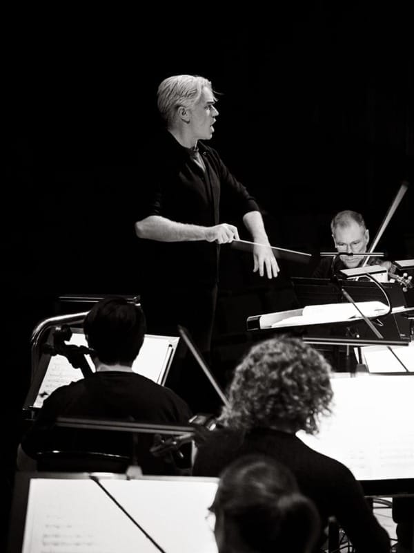 Black and white image of LPO's Principal Conductor Edward Gardner leading the London Philharmonic Orchestra.