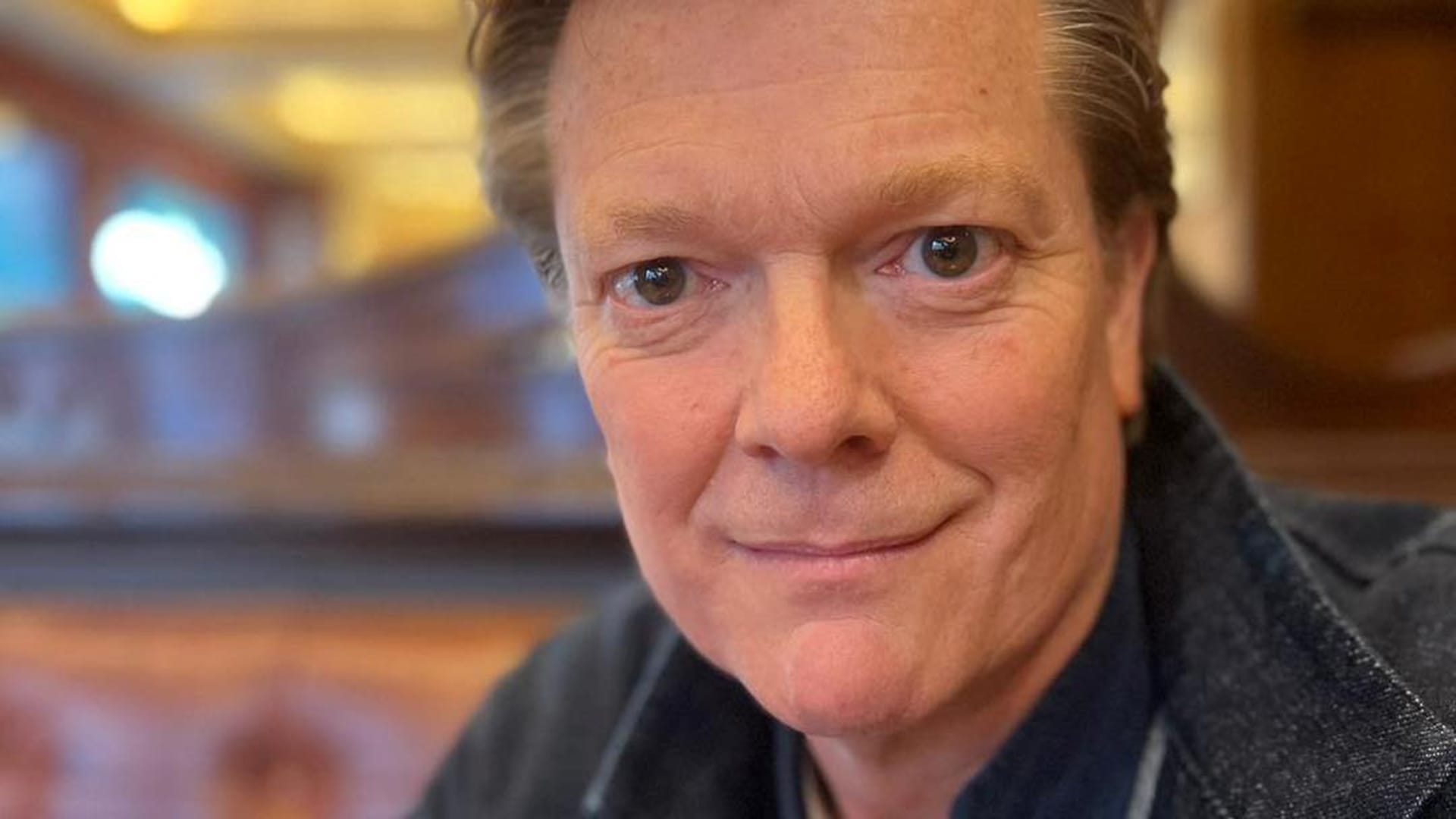 Tenor Toby Spence, a man with brown hair, wearing formal wear, portrait.