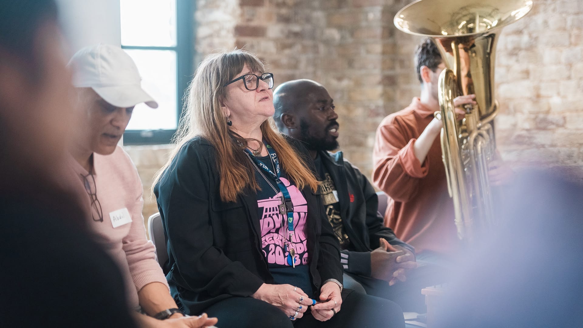 Crisis Creates participant sits contemplatively in a workshop.
