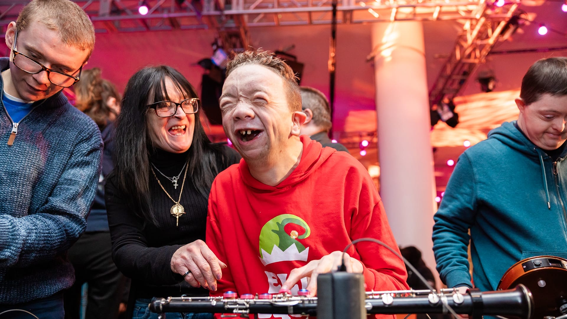 OrchLab Festival Day participant laughs whilst playing the Touch Oboe.